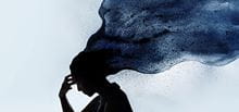 Silhouette of woman with storm clouds above head